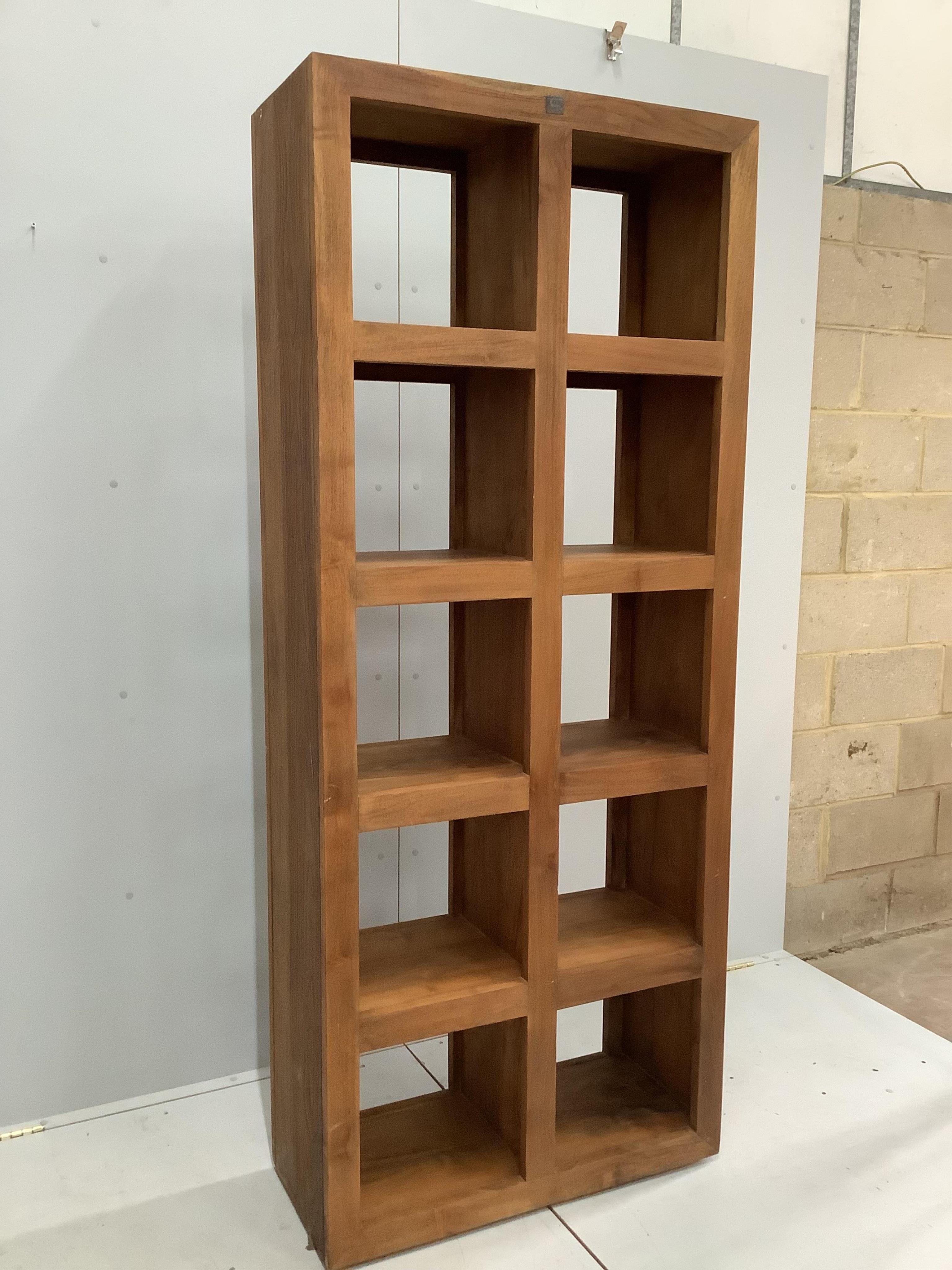 A Lombok teak open bookcase, width 82cm, depth 35cm, height 197cm. Condition - good